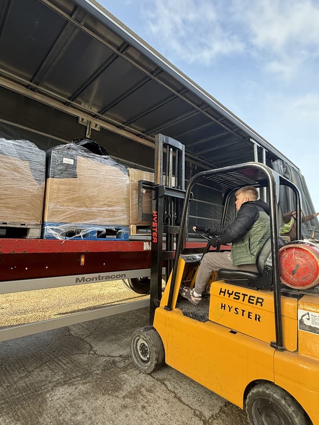 Scott operating forklift in warehouse